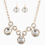 Hypnotized Gold and White Gem Statement Necklace